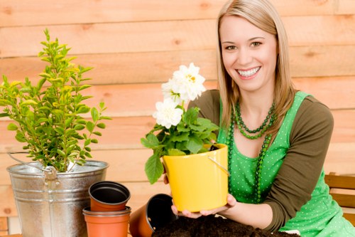 Professional gardener trimming shrubs in Palmers Green