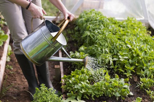Gardener inspecting tools and preparing a site risk assessment